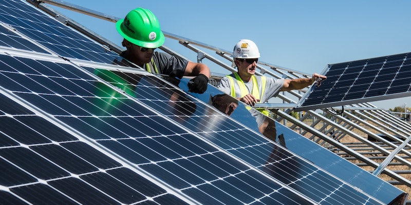 two-workers-installing-solar-panels